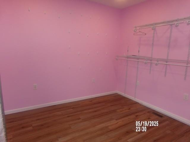 1835 Mosley Ferry Rd, Chapmansboro, TN 37035 - empty room with wood finished floors and baseboards