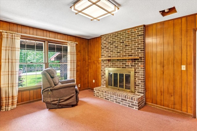 89 Belmar Cir, Manchester, TN 37355 - living room featuring wooden walls, a textured ceiling, carpet, and a fireplace