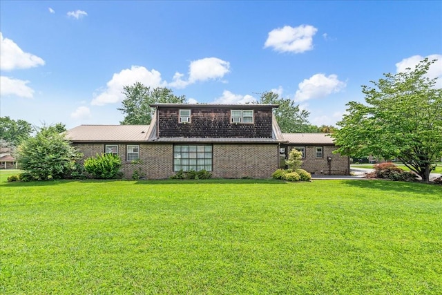 89 Belmar Cir, Manchester, TN 37355 - rear view of house featuring a lawn and a metal roof