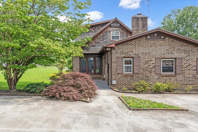 89 Belmar Cir, Manchester, TN 37355 - view of front of property featuring brick siding, a chimney, and french doors