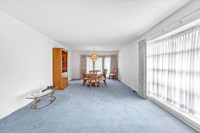 89 Belmar Cir, Manchester, TN 37355 - carpeted dining room with a chandelier and baseboards
