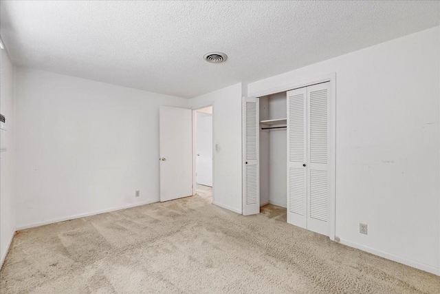 89 Belmar Cir, Manchester, TN 37355 - unfurnished bedroom with carpet flooring, a closet, and a textured ceiling