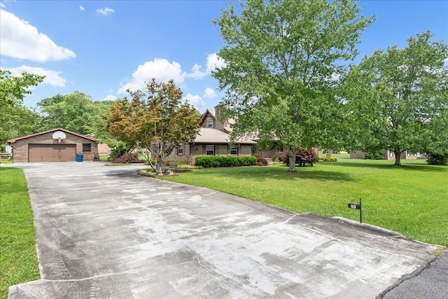 89 Belmar Cir, Manchester, TN 37355 - view of property hidden behind natural elements with a front lawn, an outdoor structure, and driveway