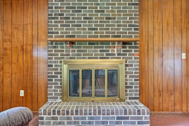 89 Belmar Cir, Manchester, TN 37355 - detailed view of wood walls, a fireplace, and carpet flooring