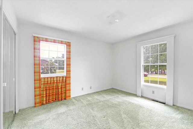 89 Belmar Cir, Manchester, TN 37355 - unfurnished bedroom with multiple windows, carpet, and a closet