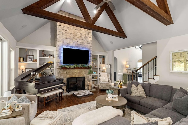 800 Singleton Ln, Brentwood, TN 37027 - living room featuring high vaulted ceiling, beam ceiling, wood finished floors, a stone fireplace, and stairs