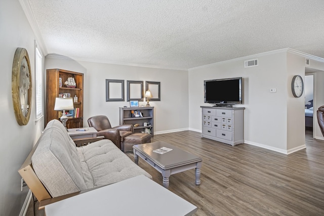 1301 Neelys Bend Rd Unit 14, Madison, TN 37115 - living room featuring a textured ceiling, wood finished floors, and ornamental molding