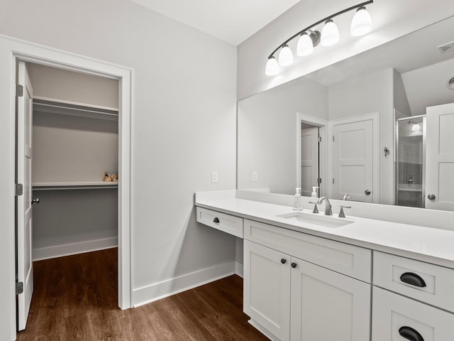 71 Windjammer Ct, Winchester, TN 37398 - full bath featuring a stall shower, a spacious closet, vanity, and wood finished floors