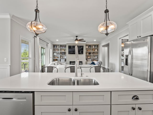 71 Windjammer Ct, Winchester, TN 37398 - kitchen featuring appliances with stainless steel finishes, light countertops, open floor plan, ceiling fan, and hanging light fixtures