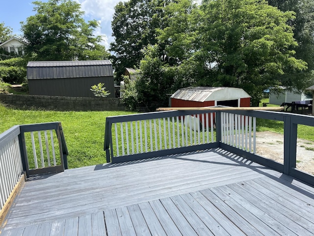 218 Ward Ave E, Carthage, TN 37030 - wooden deck featuring a storage unit, a yard, and a detached garage
