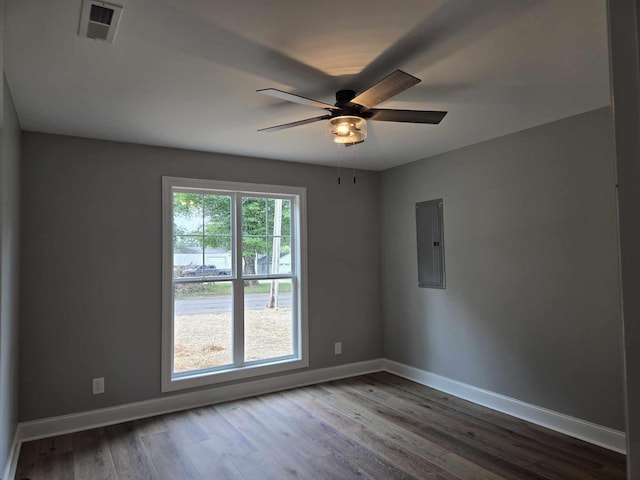 504 1st St, Lawrenceburg, TN 38464 - spare room featuring electric panel, a ceiling fan, and wood finished floors