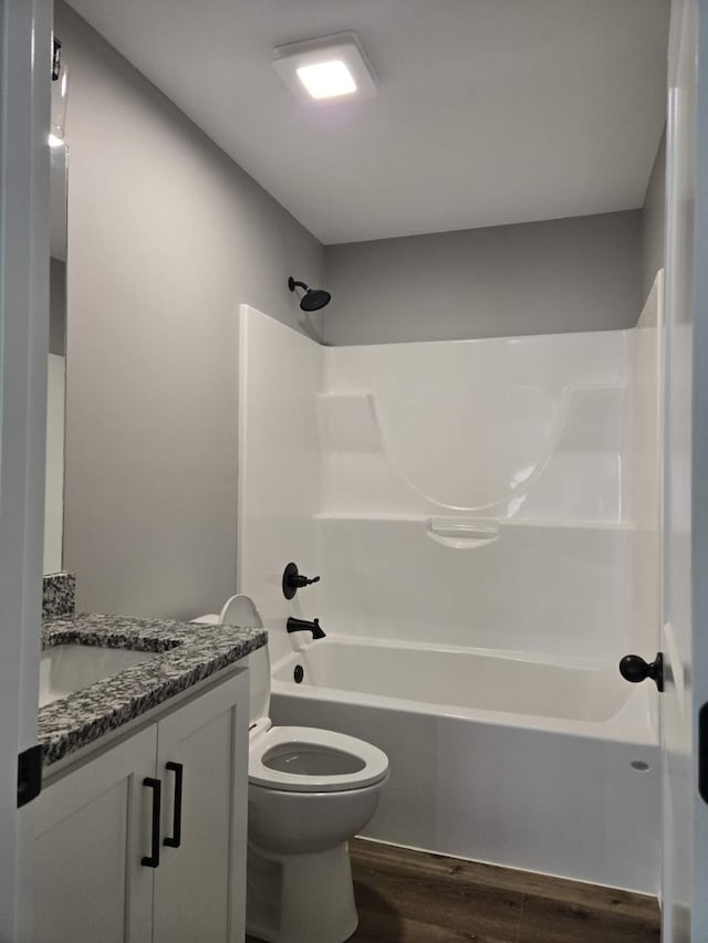 504 1st St, Lawrenceburg, TN 38464 - bathroom with wood finished floors, vanity, and tub / shower combination