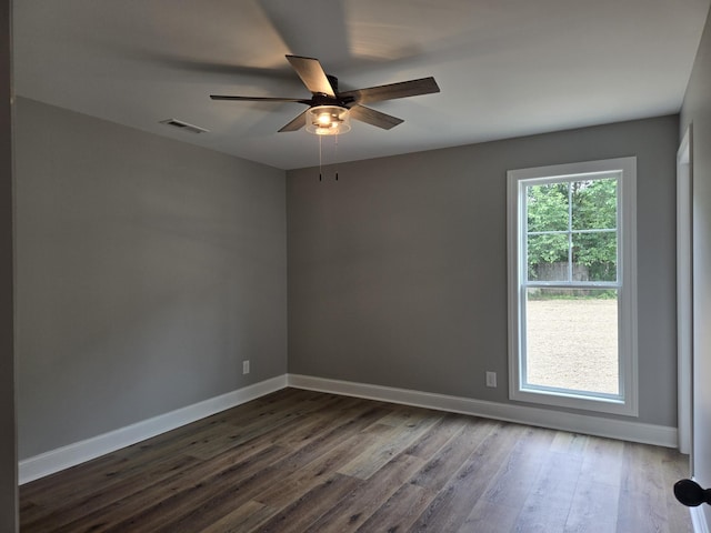 504 1st St, Lawrenceburg, TN 38464 - spare room with a ceiling fan and dark wood-type flooring