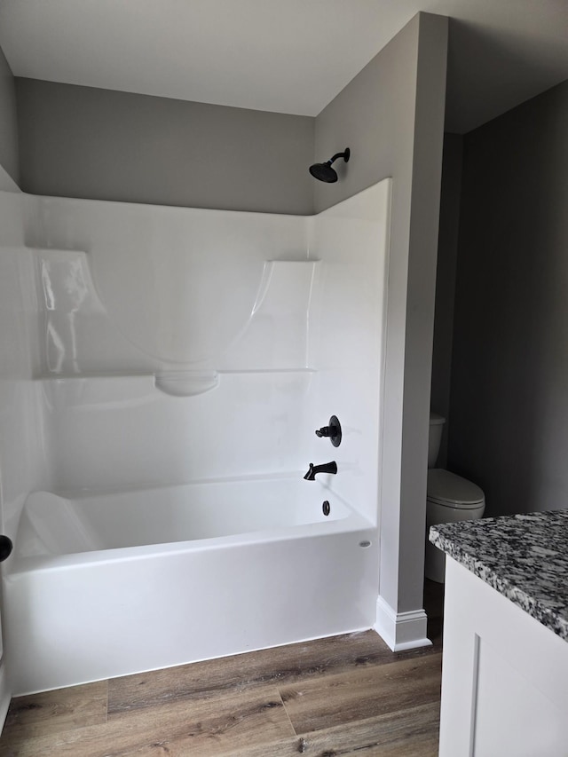 504 1st St, Lawrenceburg, TN 38464 - full bathroom featuring wood finished floors, vanity, and shower / bathtub combination