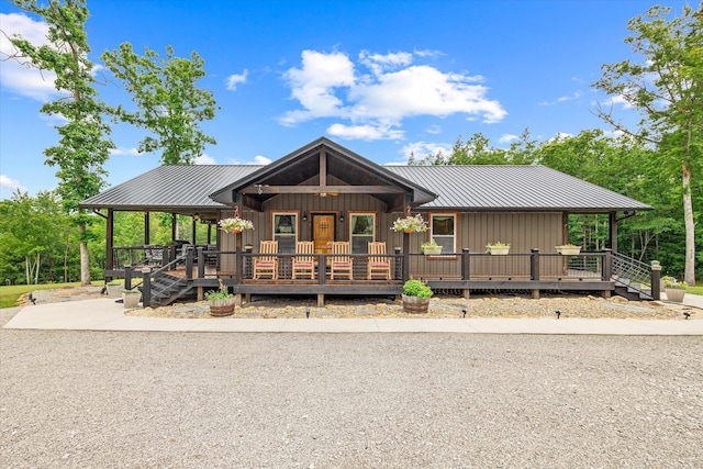634 Cowboy Way, Jamestown, TN 38556 - rustic home with a porch, a metal roof, and board and batten siding