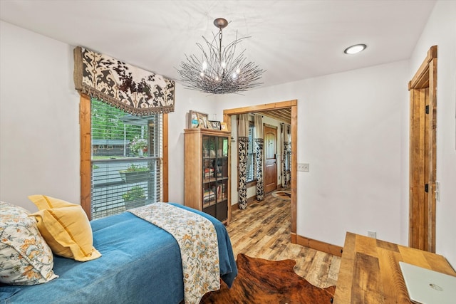 634 Cowboy Way, Jamestown, TN 38556 - bedroom with wood finished floors and a chandelier