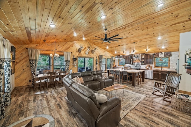634 Cowboy Way, Jamestown, TN 38556 - living room with a chandelier, wood finished floors, lofted ceiling, wood walls, and wood ceiling