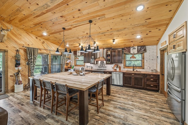634 Cowboy Way, Jamestown, TN 38556 - kitchen with appliances with stainless steel finishes, wood ceiling, dark brown cabinets, dark wood-type flooring, and a chandelier