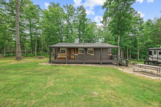 634 Cowboy Way, Jamestown, TN 38556 - view of front facade featuring a porch, a front lawn, and board and batten siding