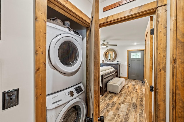 634 Cowboy Way, Jamestown, TN 38556 - laundry room with stacked washer and clothes dryer, wood finished floors, and a ceiling fan