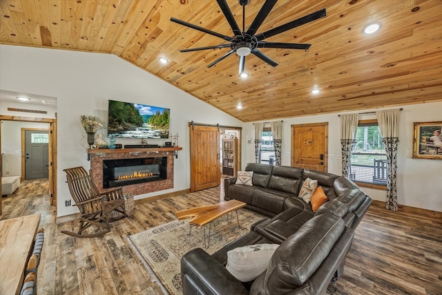 634 Cowboy Way, Jamestown, TN 38556 - living room with wood ceiling, lofted ceiling, wood finished floors, ceiling fan, and a glass covered fireplace