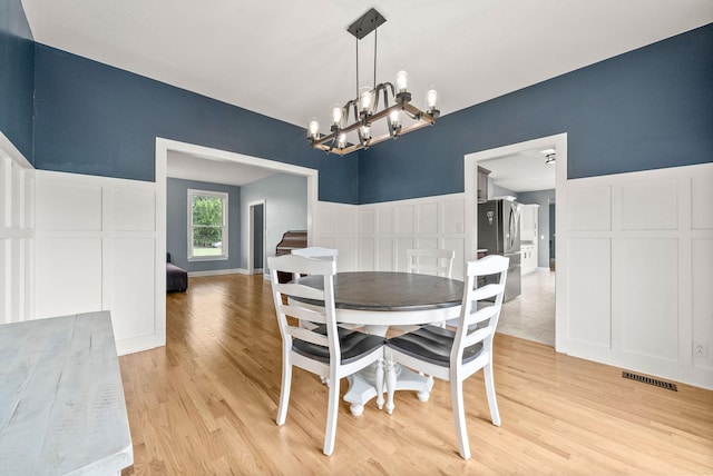 4921 Sango Rd, Clarksville, TN 37043 - dining space featuring a chandelier and light wood-type flooring