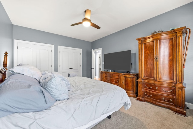 4921 Sango Rd, Clarksville, TN 37043 - bedroom with multiple closets, light carpet, and a ceiling fan