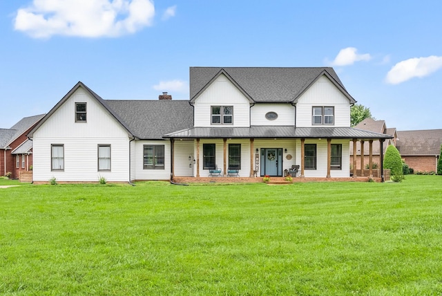4921 Sango Rd, Clarksville, TN 37043 - view of front facade with a porch, a front yard, a standing seam roof, board and batten siding, and a metal roof