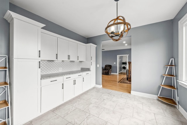 4921 Sango Rd, Clarksville, TN 37043 - kitchen with decorative backsplash, white cabinetry, a chandelier, and decorative light fixtures