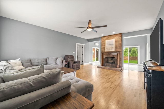 4921 Sango Rd, Clarksville, TN 37043 - living room with a ceiling fan, light wood finished floors, a brick fireplace, and recessed lighting