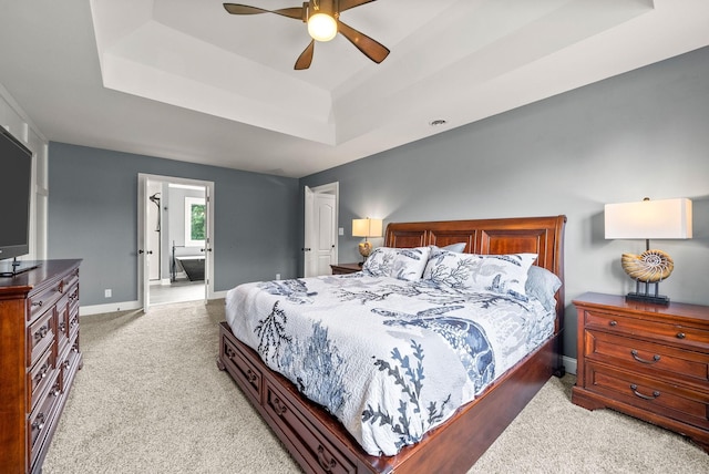 4921 Sango Rd, Clarksville, TN 37043 - bedroom with a raised ceiling, light carpet, ceiling fan, and connected bathroom