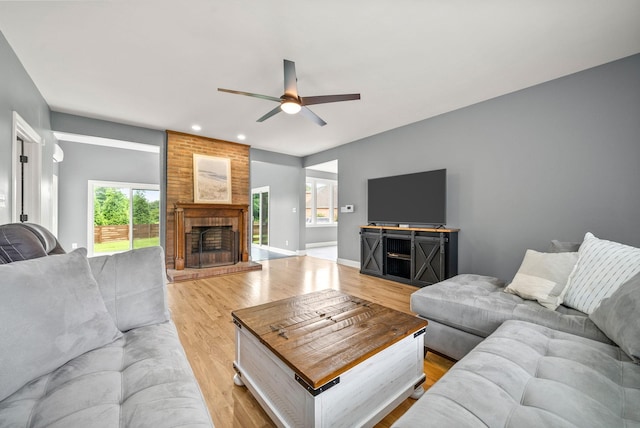 4921 Sango Rd, Clarksville, TN 37043 - living area with ceiling fan, recessed lighting, light wood-type flooring, and a fireplace