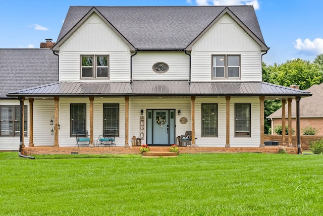 4921 Sango Rd, Clarksville, TN 37043 - view of front facade featuring a porch, board and batten siding, a front lawn, and a metal roof
