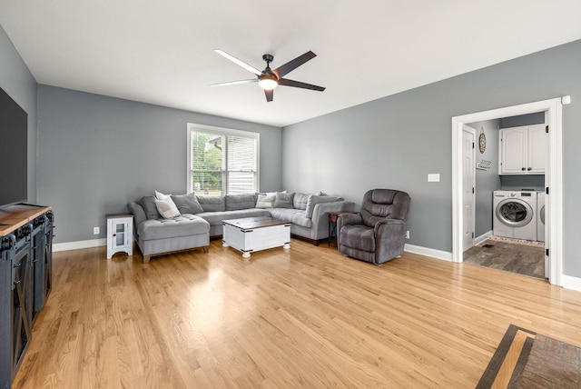 4921 Sango Rd, Clarksville, TN 37043 - living area with washer and dryer, light wood-style flooring, and ceiling fan