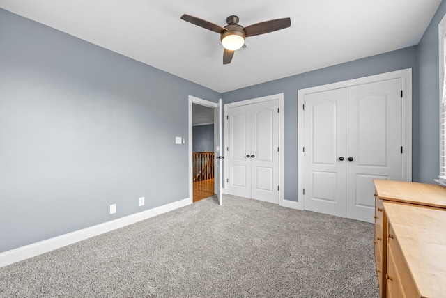 4921 Sango Rd, Clarksville, TN 37043 - unfurnished bedroom featuring two closets, carpet flooring, and a ceiling fan