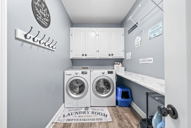 4921 Sango Rd, Clarksville, TN 37043 - washroom featuring cabinet space, washer and clothes dryer, and wood finished floors