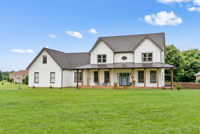 4921 Sango Rd, Clarksville, TN 37043 - modern farmhouse style home with covered porch, a standing seam roof, a front lawn, and a metal roof