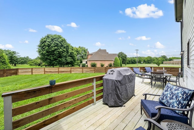 4921 Sango Rd, Clarksville, TN 37043 - wooden deck with a grill, outdoor dining area, and a fenced backyard