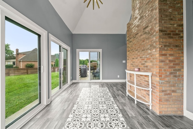4921 Sango Rd, Clarksville, TN 37043 - unfurnished sunroom featuring wood finished floors and high vaulted ceiling