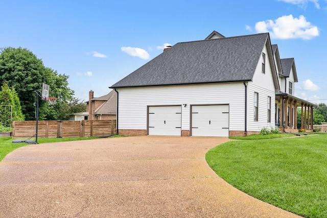 4921 Sango Rd, Clarksville, TN 37043 - view of side of property with a shingled roof, concrete driveway, and an attached garage