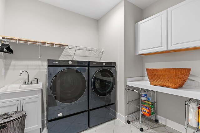 730 Fontwell Ln, Franklin, TN 37064 - laundry area with separate washer and dryer, cabinet space, and light tile patterned floors
