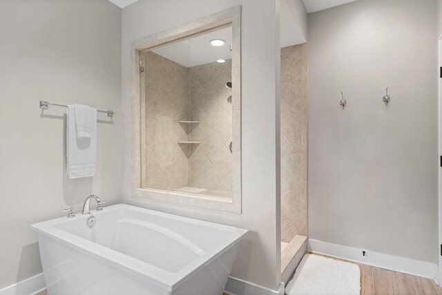 730 Fontwell Ln, Franklin, TN 37064 - full bath featuring a bath, a shower stall, and wood finished floors