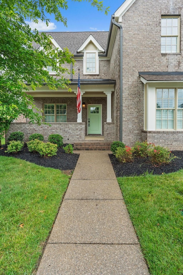 730 Fontwell Ln, Franklin, TN 37064 - view of front facade featuring brick siding, a porch, and a front lawn