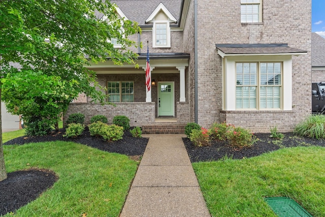 730 Fontwell Ln, Franklin, TN 37064 - view of front of home with a front yard, brick siding, and a porch