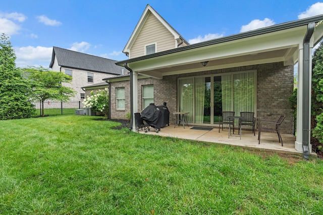 730 Fontwell Ln, Franklin, TN 37064 - back of property with brick siding, a patio, and french doors