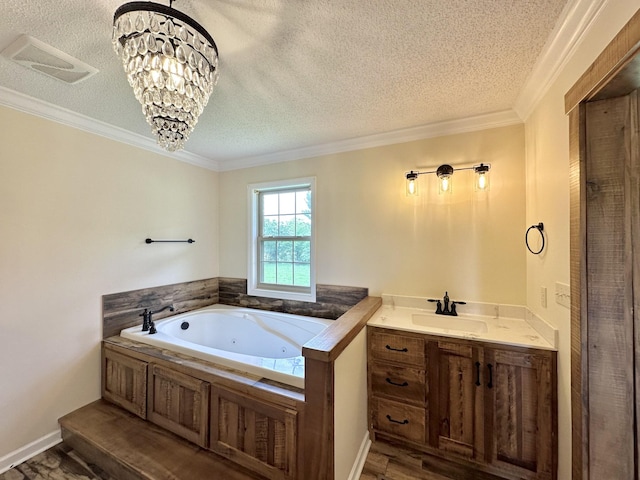 1759 Ardmore Hwy, Taft, TN 38488 - bathroom with a textured ceiling, a tub with jets, ornamental molding, vanity, and wood finished floors