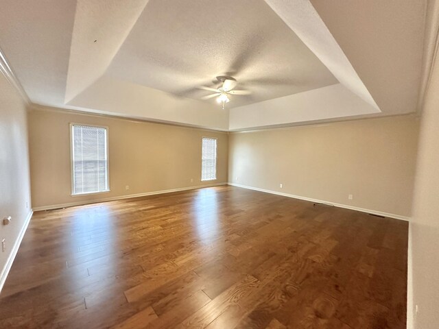 1759 Ardmore Hwy, Taft, TN 38488 - unfurnished room featuring a raised ceiling, a ceiling fan, wood finished floors, and ornamental molding