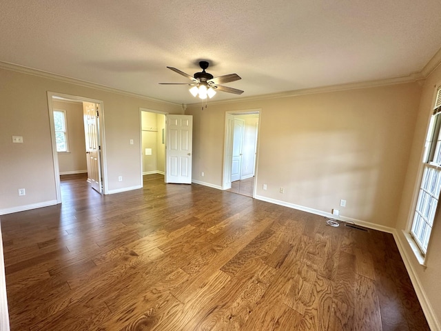 1759 Ardmore Hwy, Taft, TN 38488 - empty room featuring ornamental molding, dark wood-style floors, a ceiling fan, and a textured ceiling