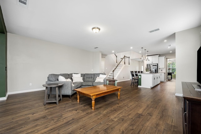810 Corlew St, Murfreesboro, TN 37130 - living room with dark wood-style floors, stairs, recessed lighting, and a chandelier