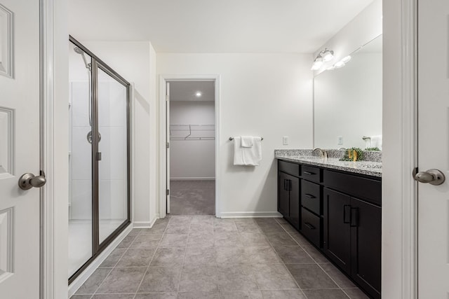 810 Corlew St, Murfreesboro, TN 37130 - bathroom with double vanity, a shower stall, and a walk in closet